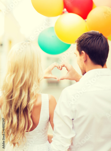 couple with colorful balloons