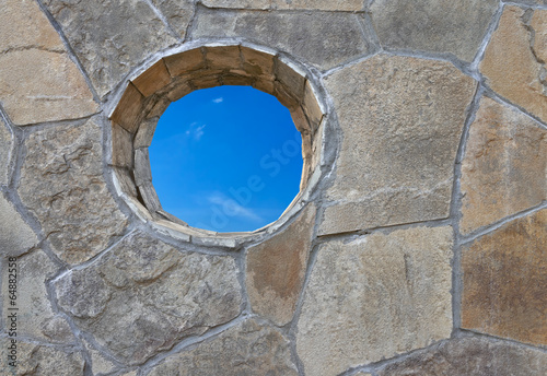 Photos Stone wall with a round hole