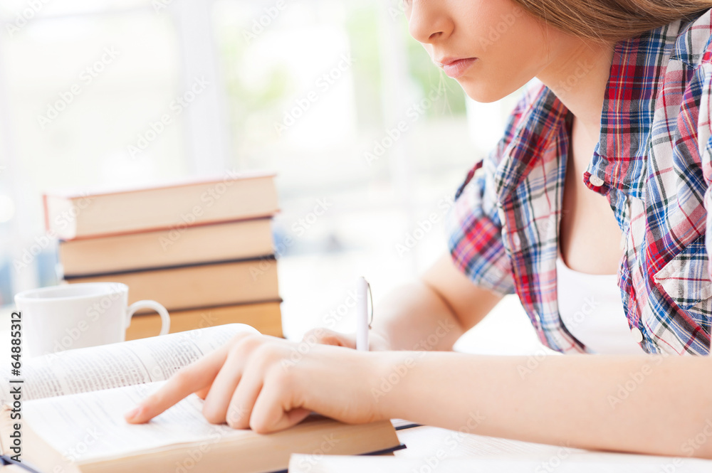 Preparing for her final exams.