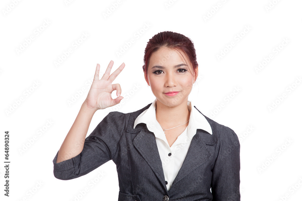 Asian business woman show OK hand sign and smile Asian business woman show OK hand sign and smile
