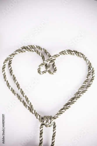 Rope valentine hart of simple design on white with copy space