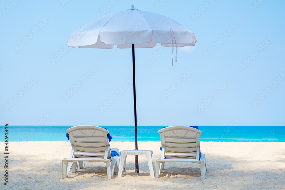 Two deckchairs on a beautiful beach