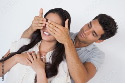 Man covering his pretty girlfriends eyes © WavebreakmediaMicro