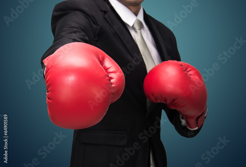 Businessman standing posture in boxing gloves isolated