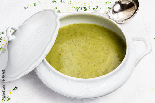 Vegetable soup in white porcelain tureen