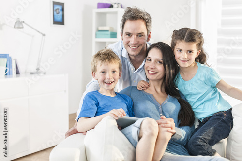 family playing together on a digital tablet