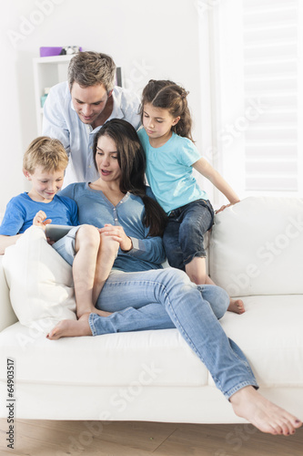 family playing together on a digital tablet