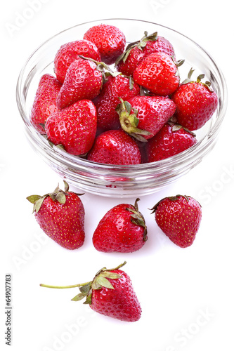 healthily raised organic strawberries in a glass bowl on white