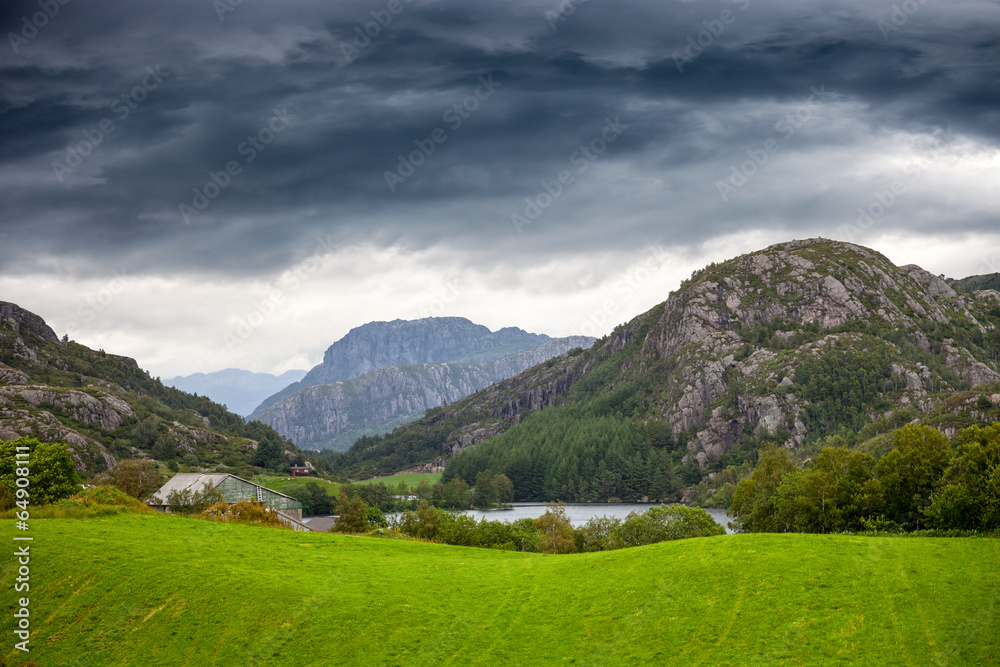 Norwegian mountains scenic with dramatic cloudy sky.