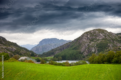 Norwegian mountains scenic with dramatic cloudy sky.