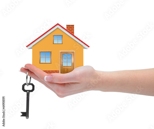 The house with keys in hand isolated on white background