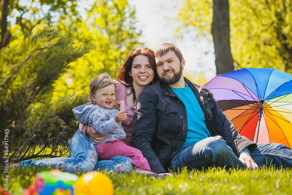 Fototapeta premium mother and father are plaing with their daughter