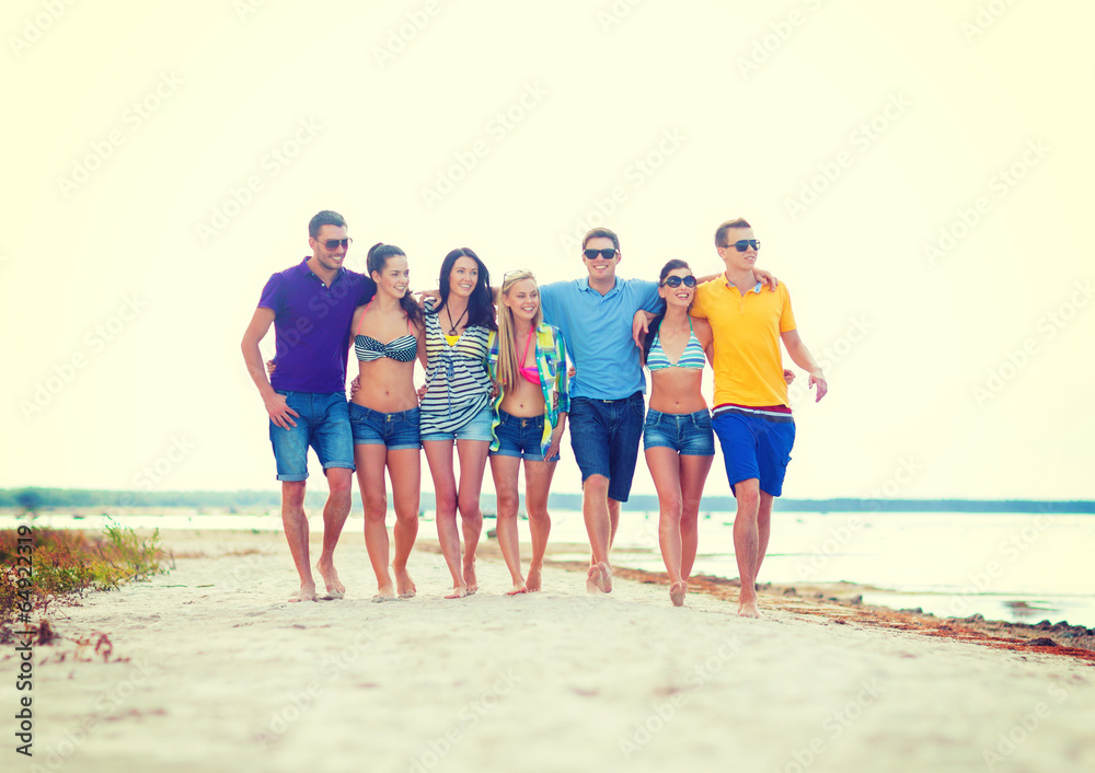 group of friends having fun on the beach