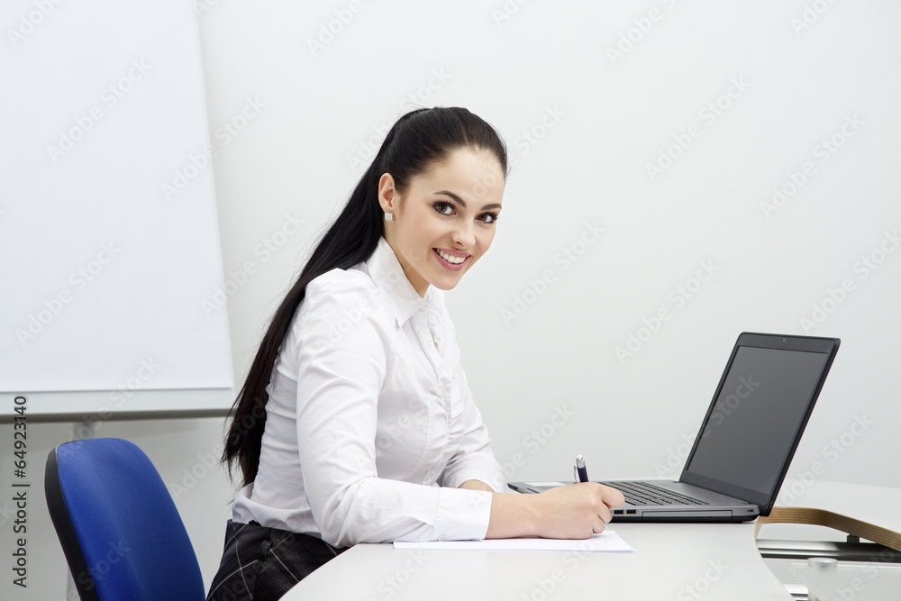 attractive young business woman with computer in office attractive young business woman with computer in office