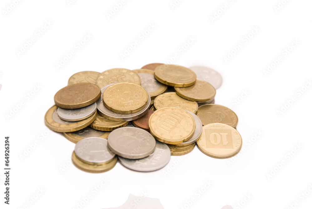 Full set of coins in pile isolated on white Full set of coins in pile isolated on white