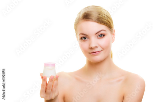 Skin care. Girl applying moisturizing cream.