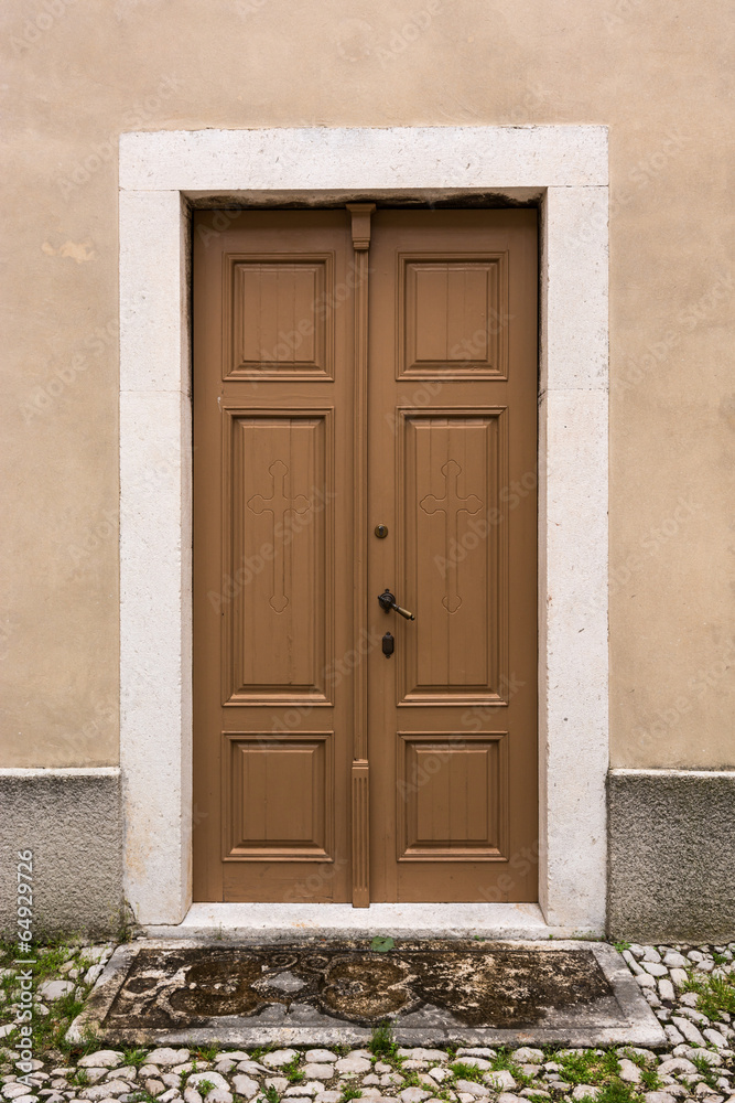 Wooden door with stone frame