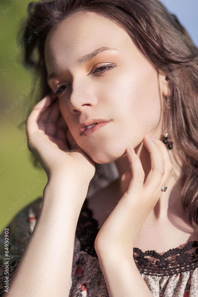 Portrait of Beautiful Romantic Girl Outdoors. Against Nature Bac Portrait of Beautiful Romantic Girl Outdoors. Against Nature Bac