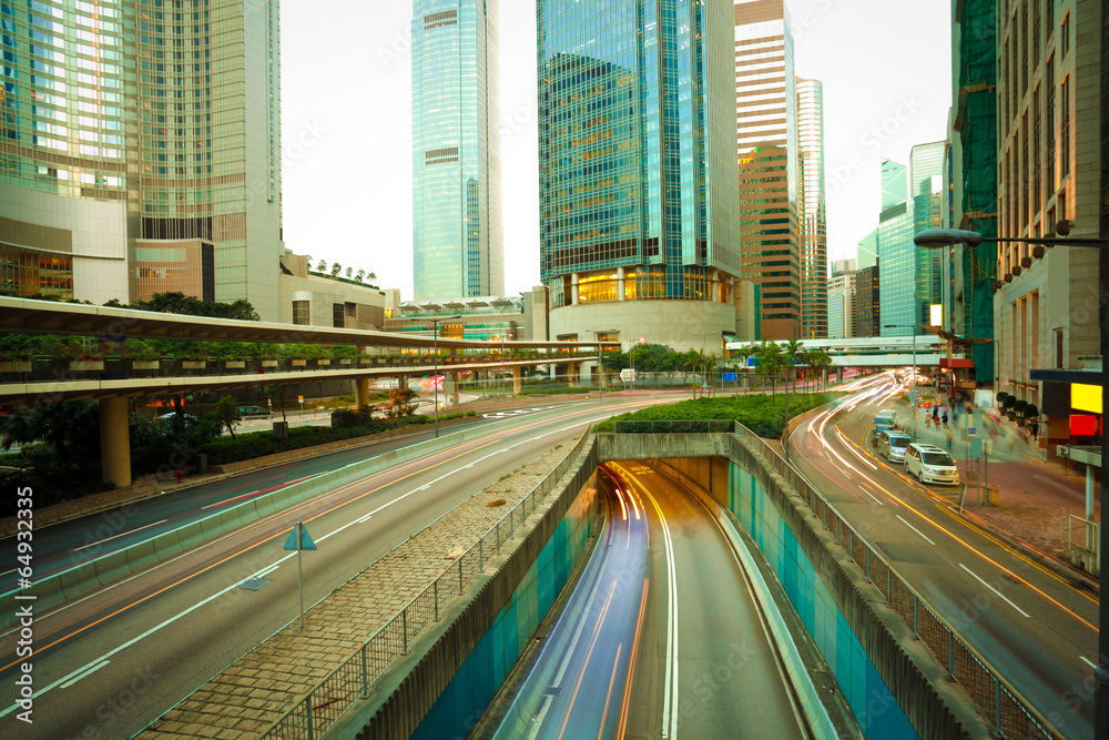 Obraz premium Road tunnels light trails on modern city buildings backgrounds i