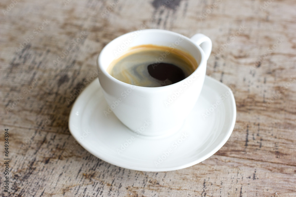 Cup of coffee on a wooden table Cup of coffee on a wooden table
