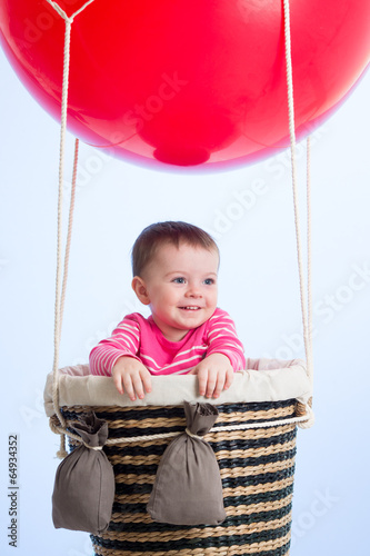 kid on hot air balloon in t...