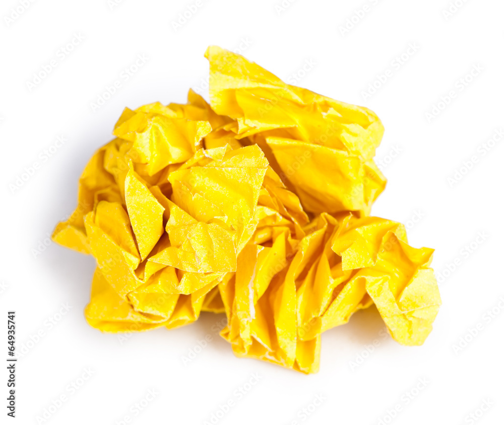 Screwed up piece of yellow paper Screwed up piece of yellow paper
