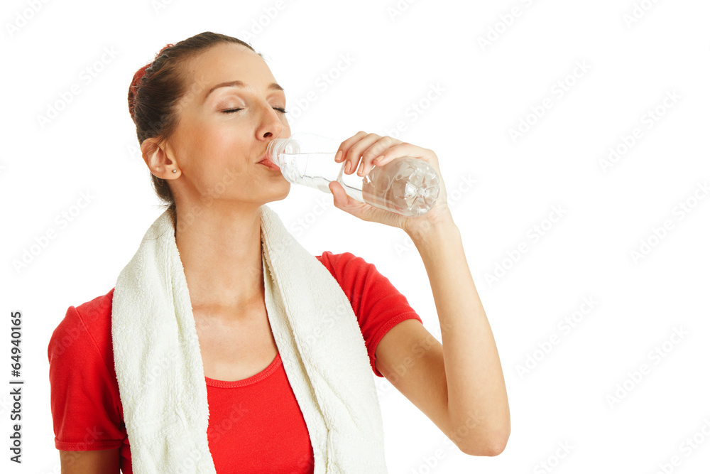 Young fitness woman drinking water from bottle Young fitness woman drinking water from bottle