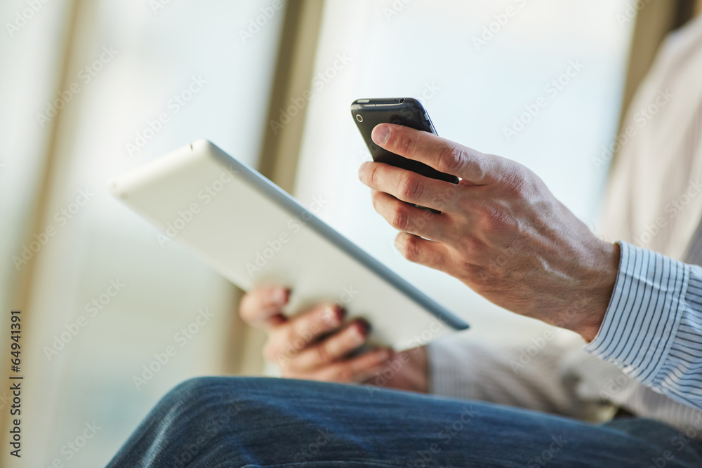 man holding digital tablet