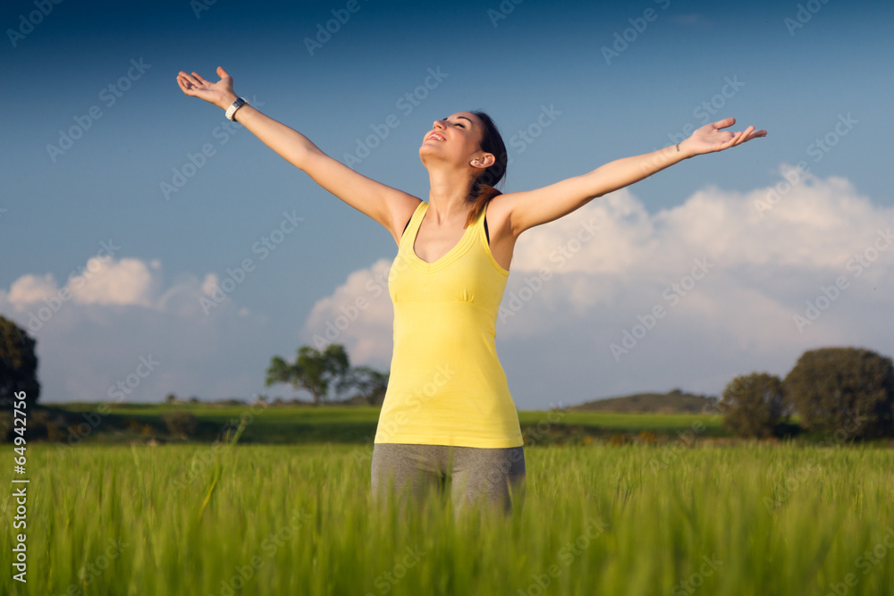 Beautiful young woman enjoying the spring standing in a cereal f Beautiful young woman enjoying the spring standing in a cereal f