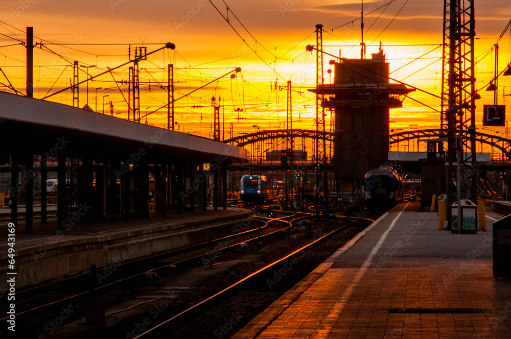 Fototapeta premium Railway station with sunset sky