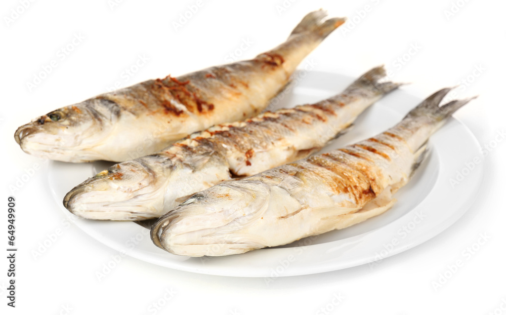 Delicious grilled fish on plate isolated on white Delicious grilled fish on plate isolated on white