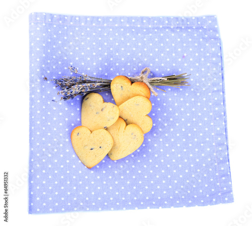 Lavender cookies on color napkin, isolated on white photo