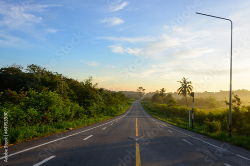 straight road and colorful sunset in thailand