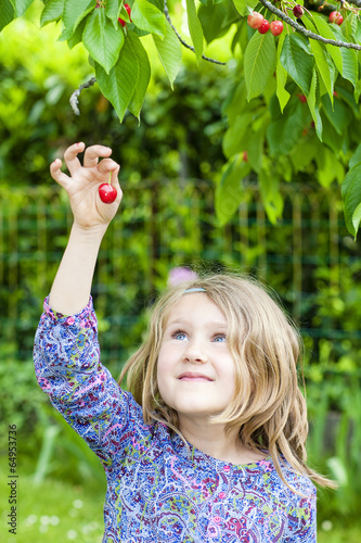 girl with cherry in the hand