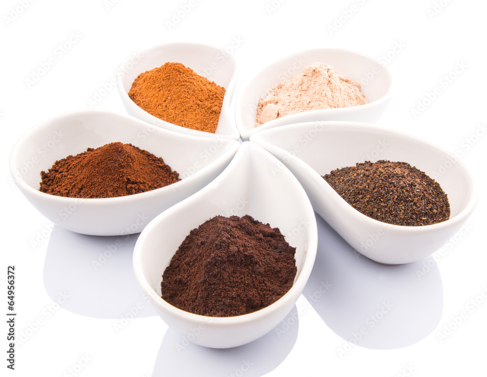 Cocoa powder, dried tea leaves and grounded coffee in ceramic Cocoa powder, dried tea leaves and grounded coffee in ceramic