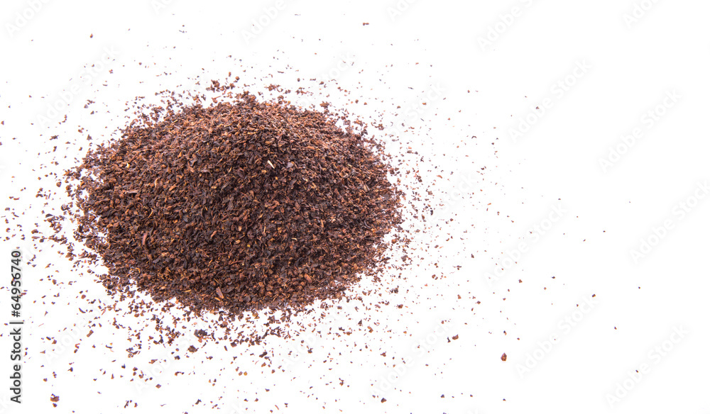Dried tea leaves over white background Dried tea leaves over white background