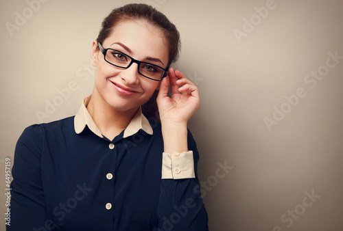 Happy business woman in glasses looking on copy space