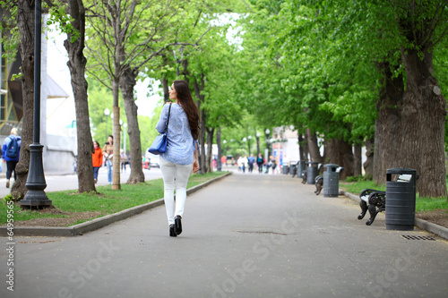 Wallpaper Mural Full length portrait of a beautiful woman in white pants and blu Torontodigital.ca