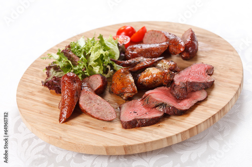 sausages on a wooden cutting board