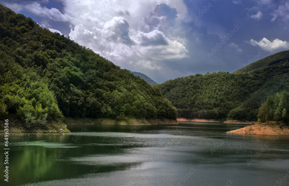 lake in the mountain with dramatic sky