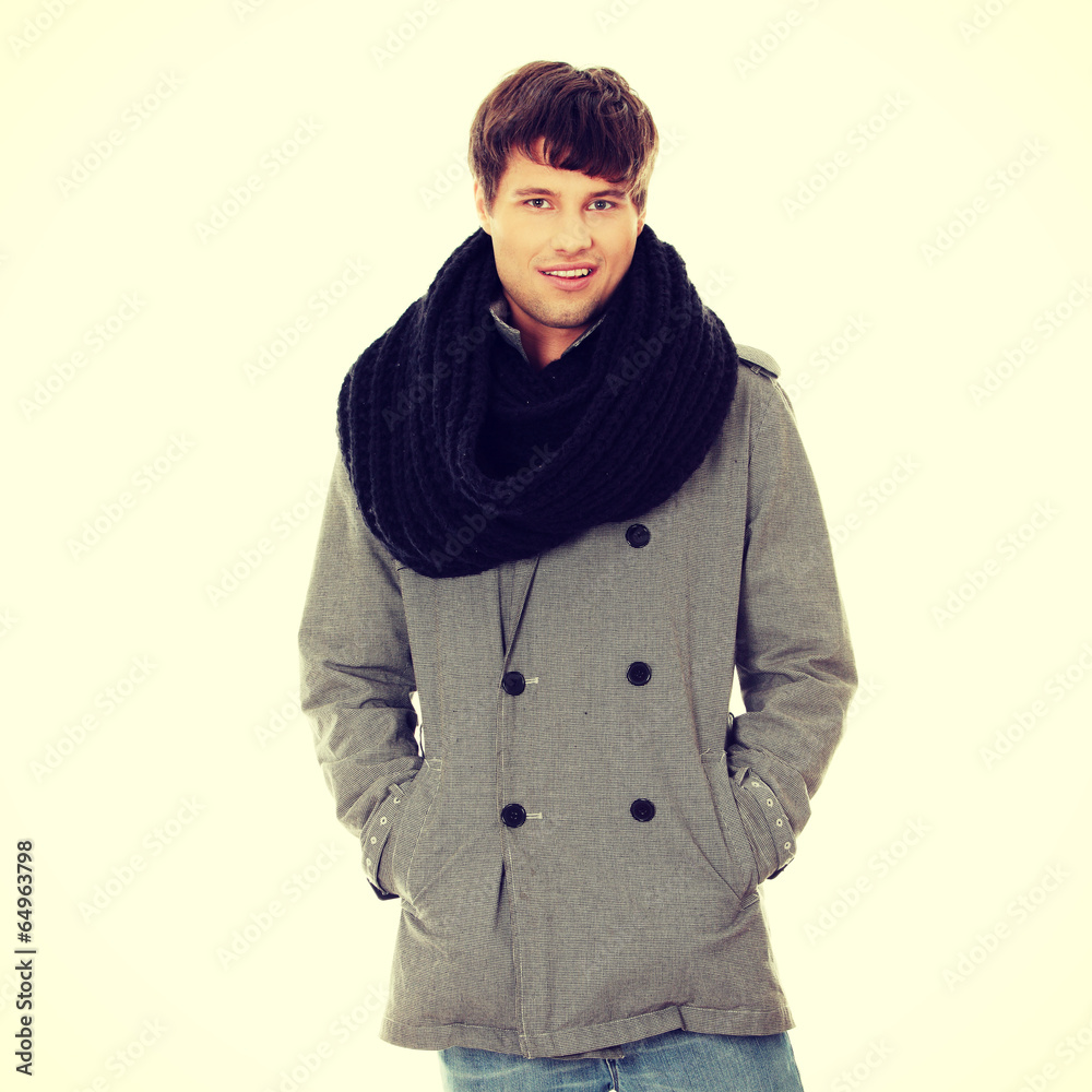 Handsome man in scarf and coat