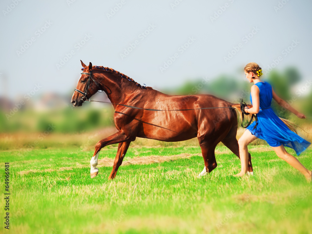 Fototapeta premium Running young beautiful girl with her horse