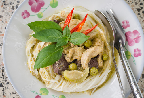 Green curry with rice vermicelli ,Thai traditional cuisine. photo