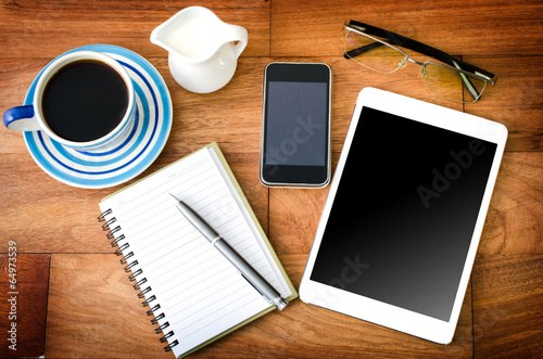 tablet pc and a coffee and Mobile phone
