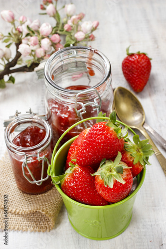 Bucket of strawberries on wooden table