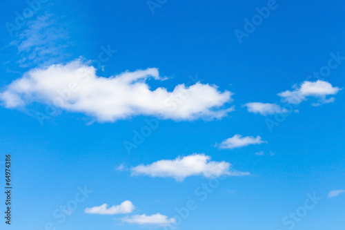 Fototapeta Naklejka Na Ścianę i Meble -  few little fluffy white clouds in blue sky