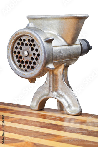 old iron meat mincer installed on table photo