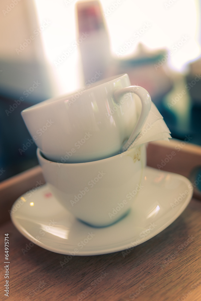 white cups coffee overlap on the wood desk white cups coffee overlap on the wood desk