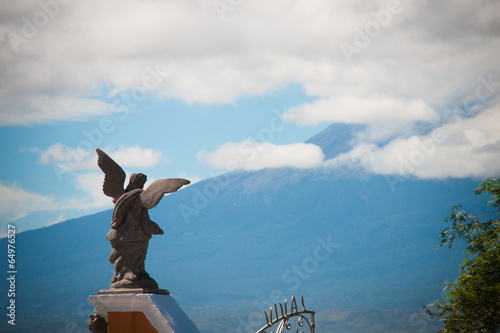 Angel looking on volcano