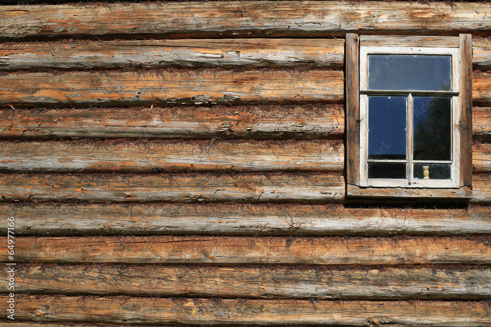 Window in an old wooden house, village